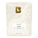 A white bag of BKG Echoes whole bean coffee with a white label and black text.