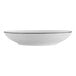 A white porcelain serving bowl with a black rim.