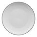 A white porcelain coupe plate with a black rim.