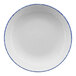 A white porcelain pasta bowl with a blue rim.