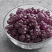 A glass bowl of Albanese Grape Gummi Bears.