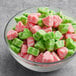 A bowl of green and pink Albanese Watermelon Gummi Slices.