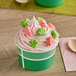 A bowl of green and white Albanese Watermelon Gummi Slices.