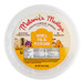 A package of Melanie's Honey, Fig, and Pistachio Cream Cheese spread on a white background.