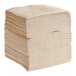 A large stack of beige Choice Touchstone Linen-Feel beverage napkins.