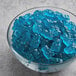 A bowl of Albanese Blue Raspberry Gummi Bears on a table.