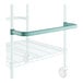 A close-up of a white and green metal shelf with U-shaped green handles.