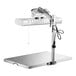 A stainless steel Pavoni sugar heating lamp with a white light on it.