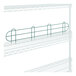 A white metal wire shelf with a green metal ledge.