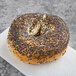 A Just Bagels poppy seed bagel with black specks on top.