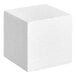 A close-up of a white Baker's Lane foam cube with a textured surface.