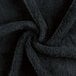 A close up of a black Monarch Brands coral fleece hand towel.