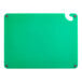 A green Choice cutting board with a ruler and grips.