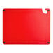 A red plastic Choice cutting board with ruler, grips, and a hole in the middle.