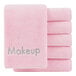 A stack of pink Monarch Brands makeup wash cloths with the word makeup on them.
