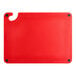 A red plastic Choice cutting board with a handle.