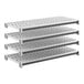 A set of four vented plastic shelving panels designed for modular storage systems.