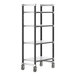 A black metal Cambro Camshelving unit with four shelves on wheels.