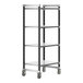 A black and silver Cambro Camshelving unit with white shelves on wheels.