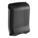 A black and silver Tork hand towel dispenser.