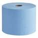 A giant roll of blue Tork medium-duty industrial wipers.