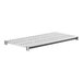 A white metal shelf with metal slats.