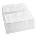 A stack of white Tork Advanced dinner napkins.