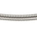 A close-up of Equip by T&S 68" stainless steel hose with a silver spiral wire.