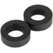 A pair of black rubber washers with round holes.