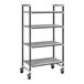 A Cambro Elements XTRA metal shelving unit with wheels and four vents shelves.