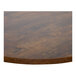 A BFM Seating Relic round table top with a brown surface and matching edge.