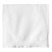 A white Tork paper wiper on a white surface.