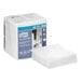 A close-up of a box of Tork white light-duty paper wipers with a white background.