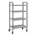 A Cambro Camshelving Elements XTRA metal shelving unit with wheels.