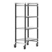 A Cambro Elements XTRA metal shelving unit with wheels and four shelves.