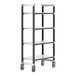 A black Cambro metal shelving unit with four white shelves and wheels.