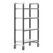 A black metal Cambro Camshelving unit with white shelves and wheels.
