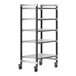 A Cambro Elements XTRA metal shelving unit with vented shelves on wheels.