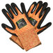 A pair of Cordova heavy duty work gloves with black and orange trim and a black sandy nitrile palm.