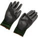 A pair of Cordova green and black work gloves.