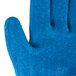 A close up of a small blue Cordova glove with a crinkle latex palm.