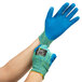 A pair of small blue Cordova iON heavy duty work gloves with blue crinkle latex palms.