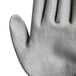 A close-up of a Cordova Monarch heavy duty glove with a gray polyurethane palm coating.