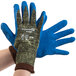 A pair of Cordova small cut-resistant gloves with blue latex palms.