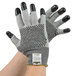 A pair of extra small Cordova Monarch cut-resistant gloves with two-sided black nitrile dots.