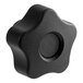 A black plastic knob with a round center.