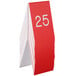 A stack of red Cal-Mil table tents with white numbers.