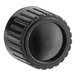 A black circular knob with a circular design.