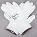 A pair of white Cordova warehouse gloves with white polyurethane palms.