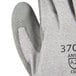 A close-up of a small Cordova HPPE glove with gray polyurethane coating on the palm.